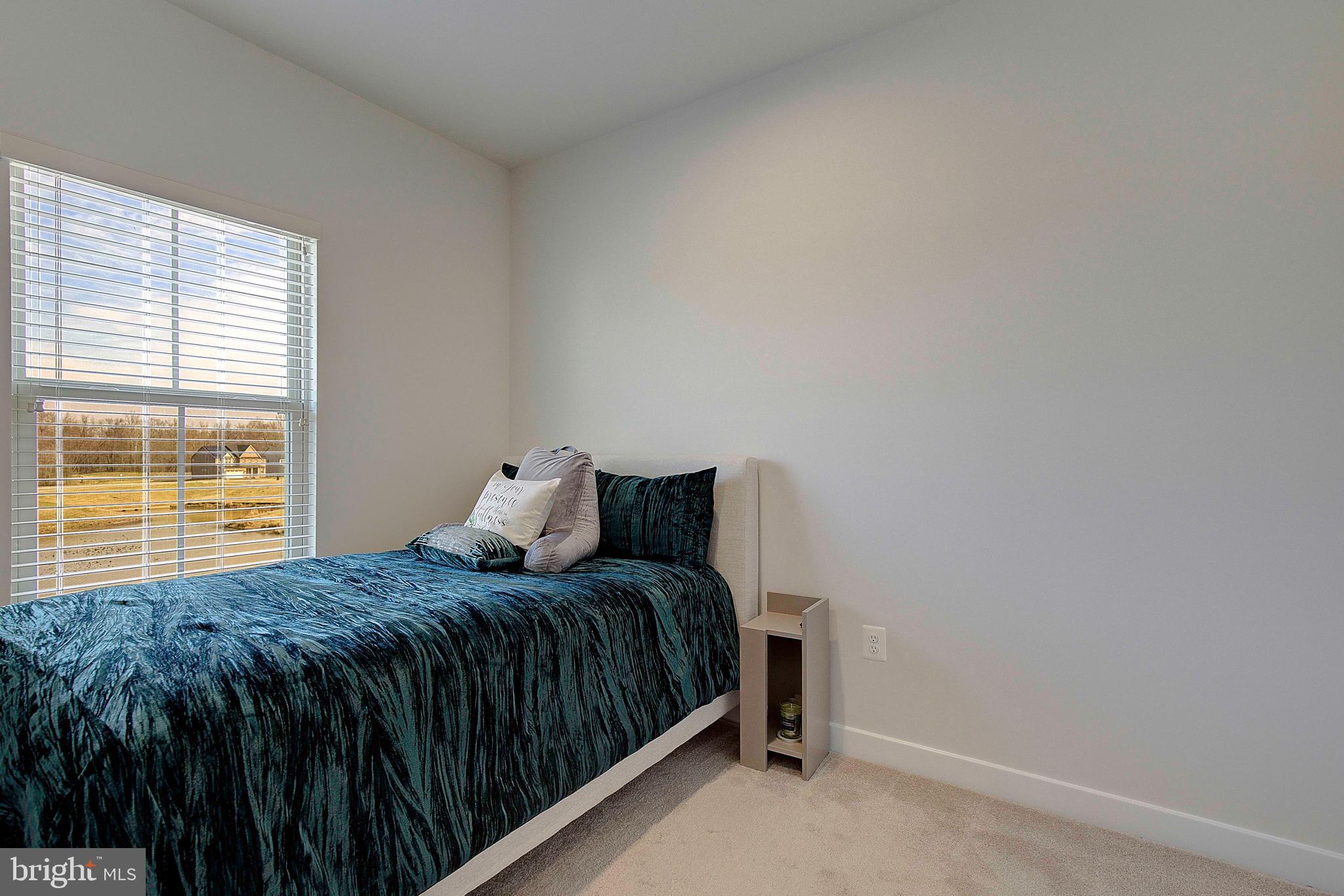 121 Swanson Creek Terrace Laurel, MD 20708 - Photo 23 of 31 a bedroom with a bed and window