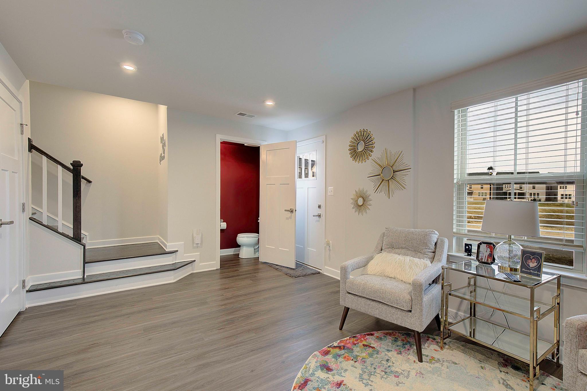 121 Swanson Creek Terrace Laurel, MD 20708 - Photo 6 of 31 a living room with furniture and wooden floor