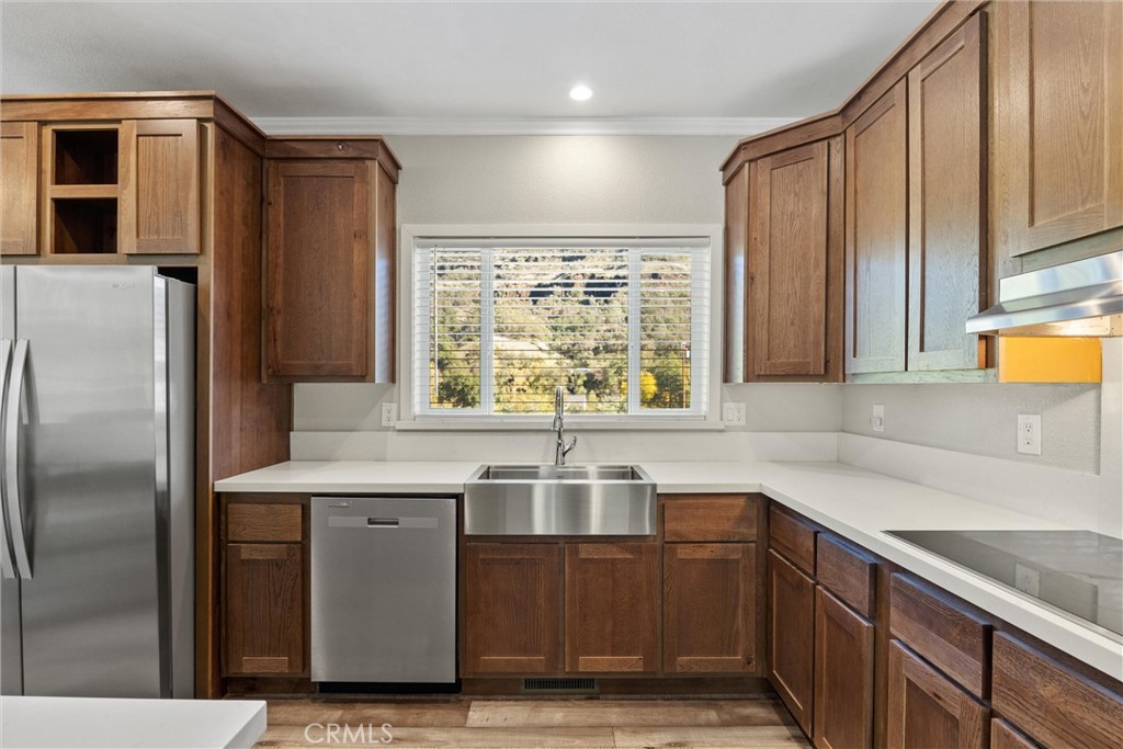 12656 Centerville Road Chico, CA 95928 - Photo 12 of 46 a kitchen with kitchen island a sink stove and refrigerator