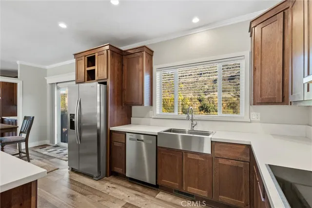a kitchen with a sink cabinets and window