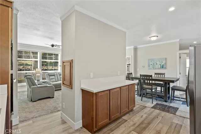 a kitchen with stainless steel appliances granite countertop a sink a cabinets and wooden floor