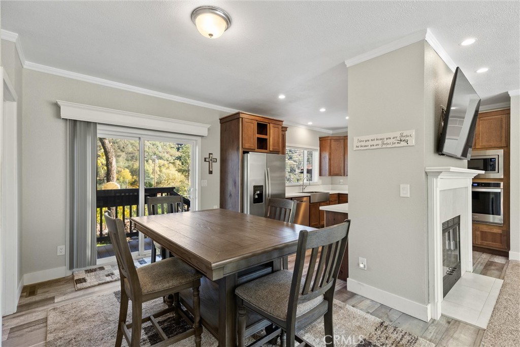 12656 Centerville Road Chico, CA 95928 - Photo 18 of 46 a view of a dining room with furniture window and wooden floor