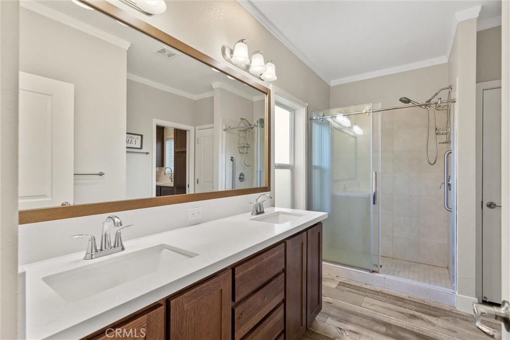 12656 Centerville Road Chico, CA 95928 - Photo 21 of 46 a bathroom with a double vanity sink mirror and shower