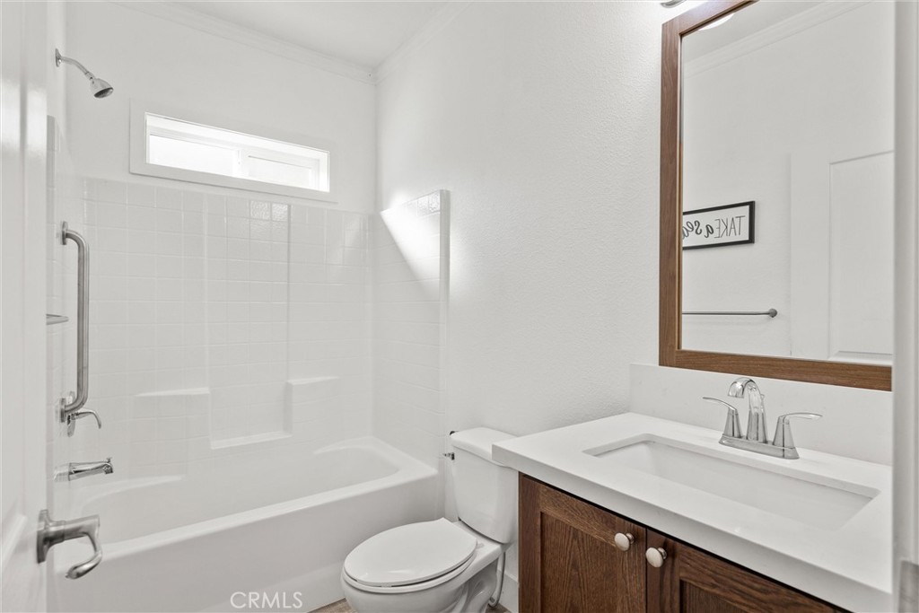 12656 Centerville Road Chico, CA 95928 - Photo 24 of 46 a bathroom with a granite countertop sink toilet and shower