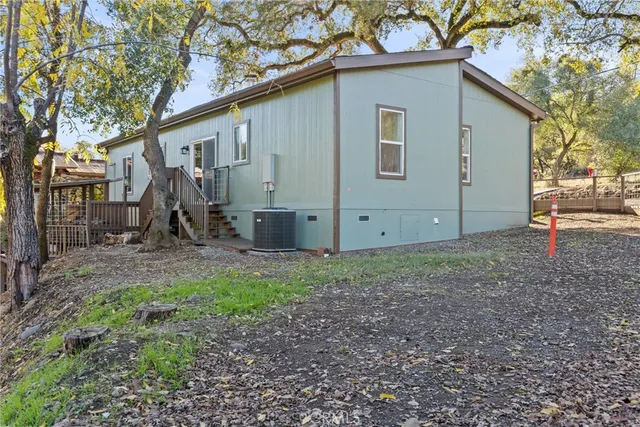 a backyard of a house with wooden fence