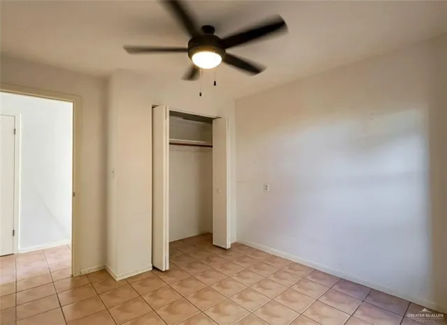 an empty room with fan
