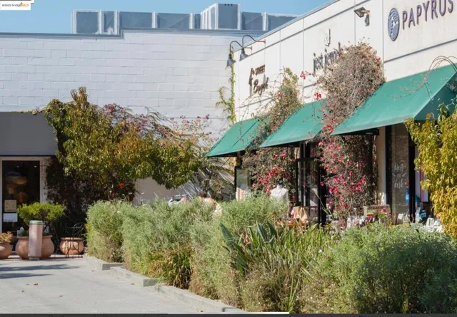 a view of a street with stores