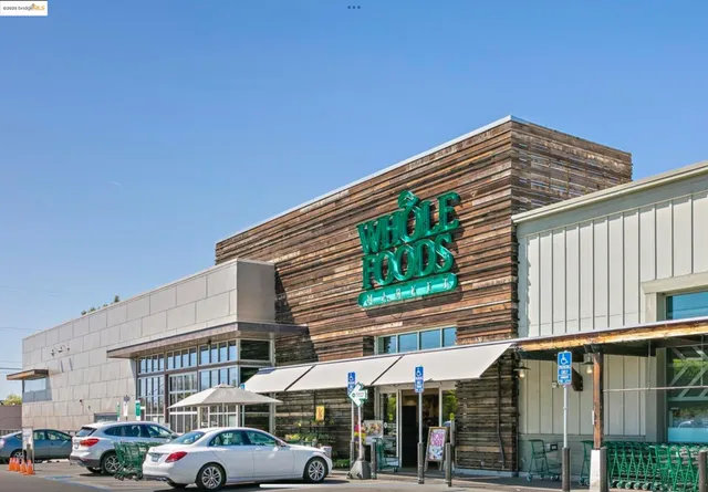 a clock on a wall next to road