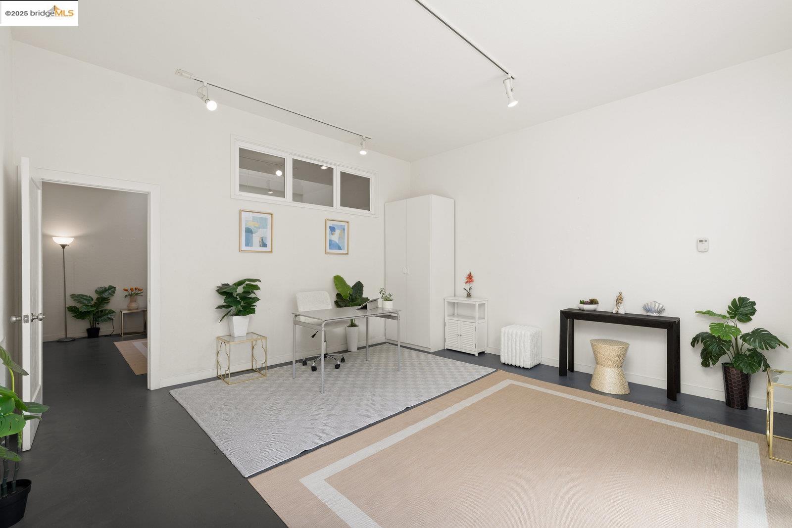 1450 Fourth Street, Unit 5 Berkeley, CA 94710 - Photo 4 of 18 a living room with furniture and wooden floor