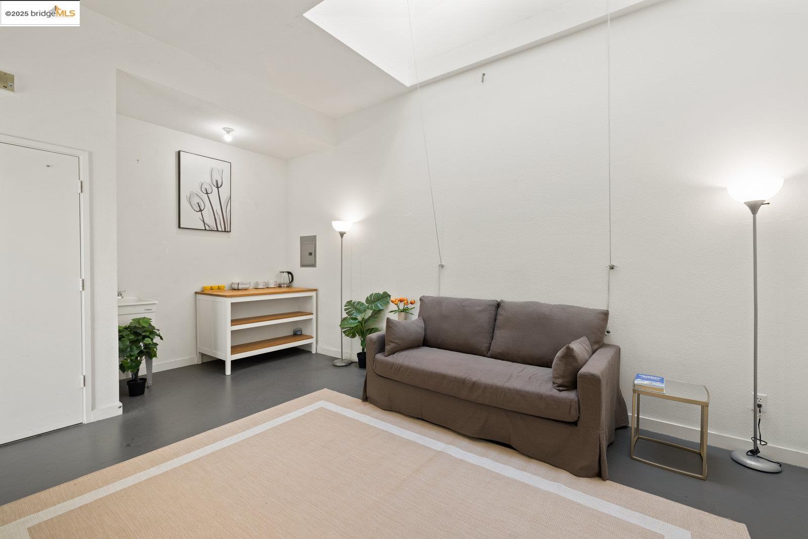 1450 Fourth Street, Unit 5 Berkeley, CA 94710 - Photo 5 of 18 a living room with furniture and a couch