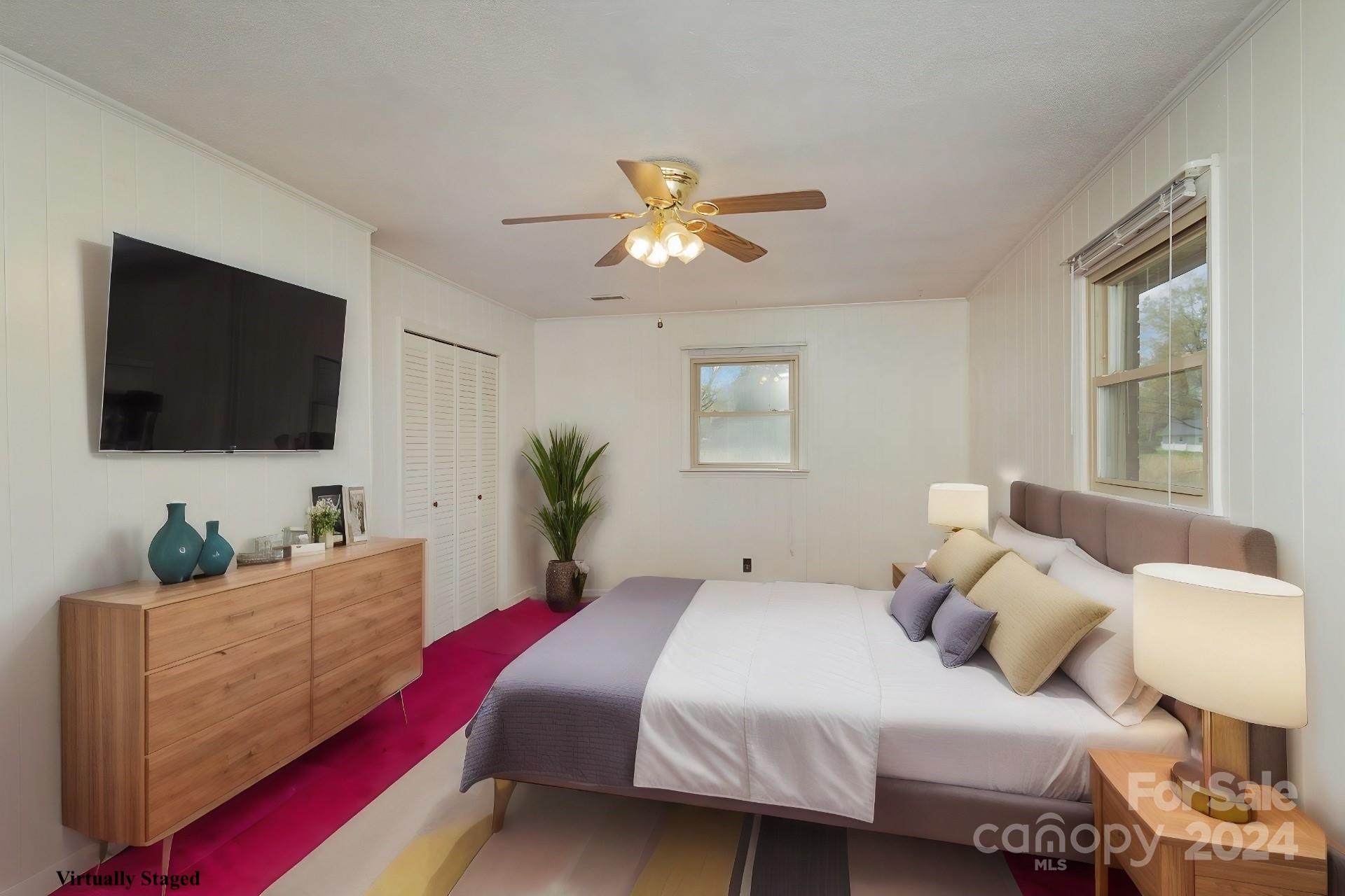 4007 Beaty Road Gastonia, NC 28056 - Photo 12 of 24 a bedroom with a bed and a flat screen tv