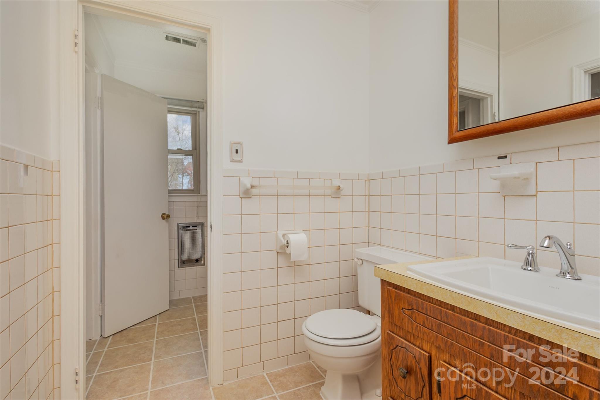 4007 Beaty Road Gastonia, NC 28056 - Photo 14 of 24 a bathroom with a sink and a toilet