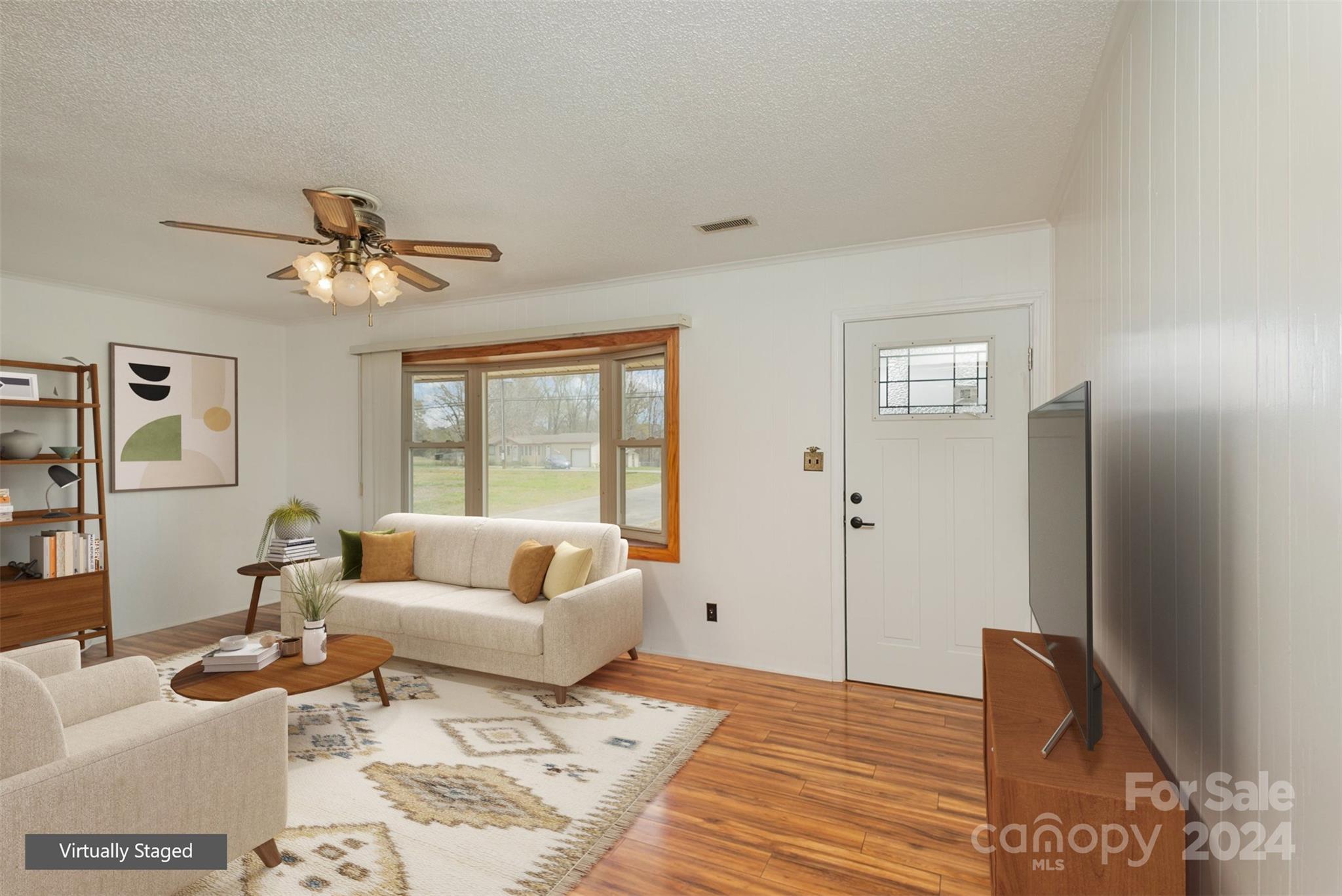 4007 Beaty Road Gastonia, NC 28056 - Photo 2 of 24 a living room with furniture and a chandelier