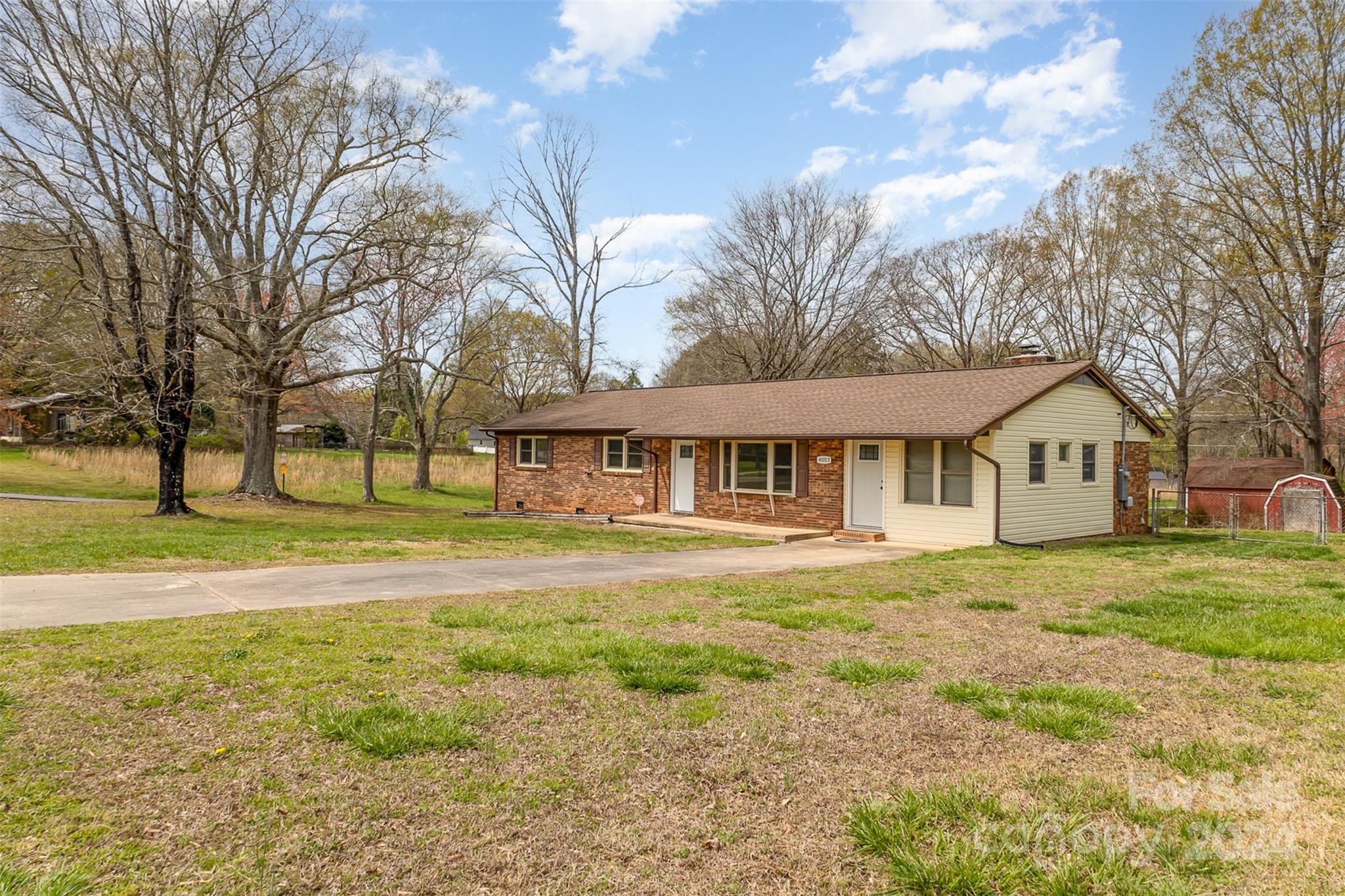 4007 Beaty Road Gastonia, NC 28056 - Photo 22 of 24 a front view of a house with a garden