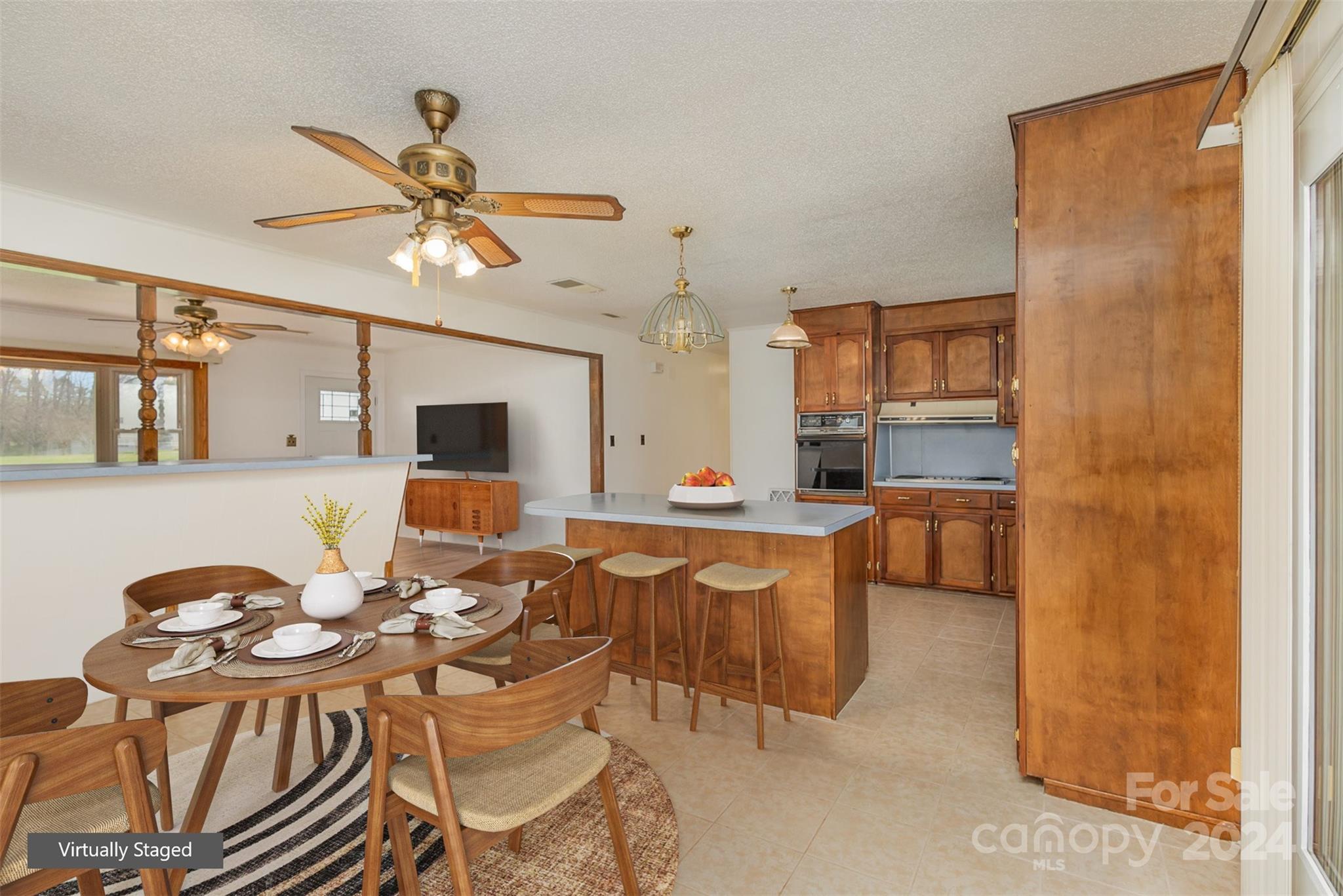 4007 Beaty Road Gastonia, NC 28056 - Photo 5 of 24 a view of a dining room with furniture and a chandelier