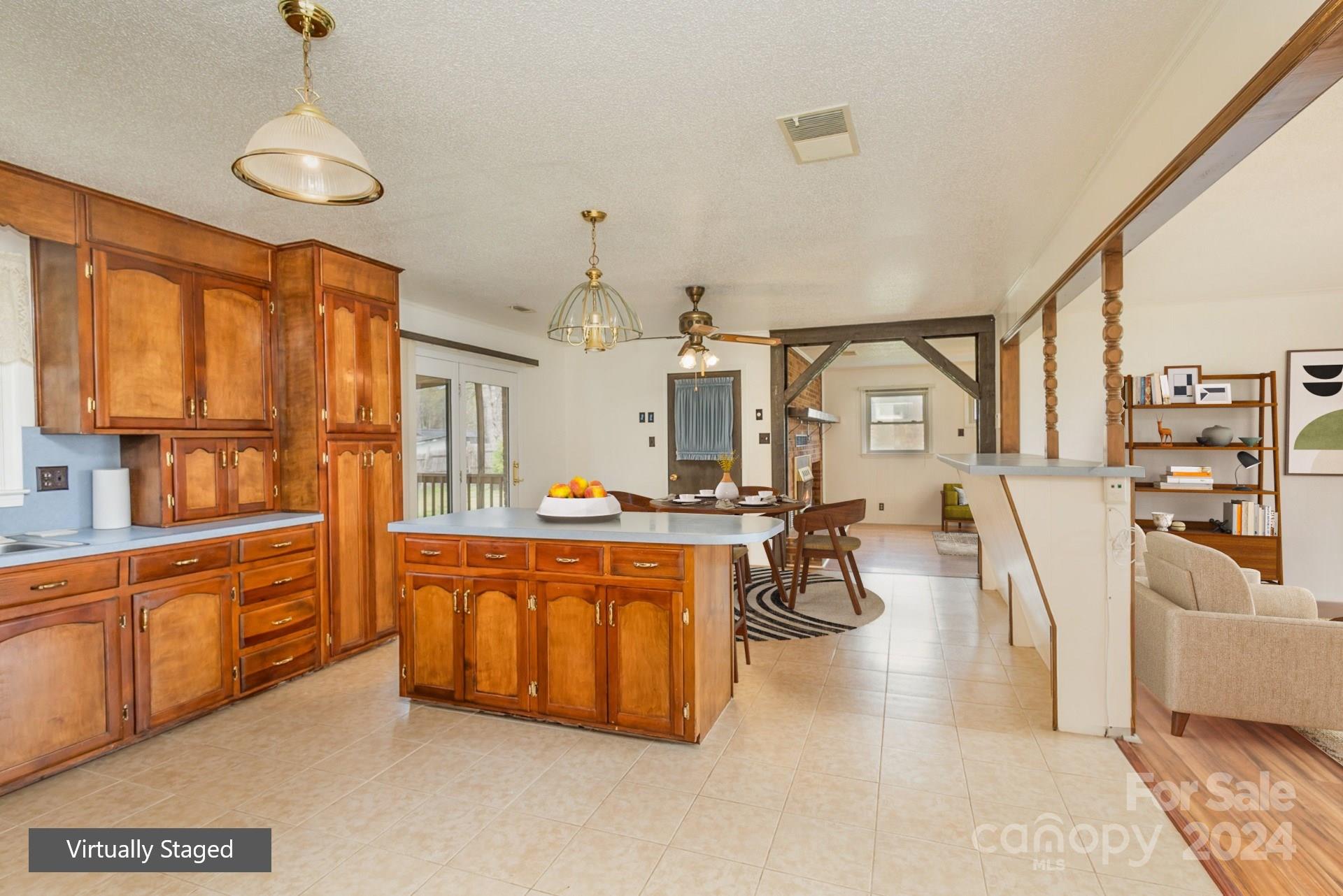 4007 Beaty Road Gastonia, NC 28056 - Photo 6 of 24 a large kitchen with stainless steel appliances kitchen island granite countertop a large counter top and white cabinets