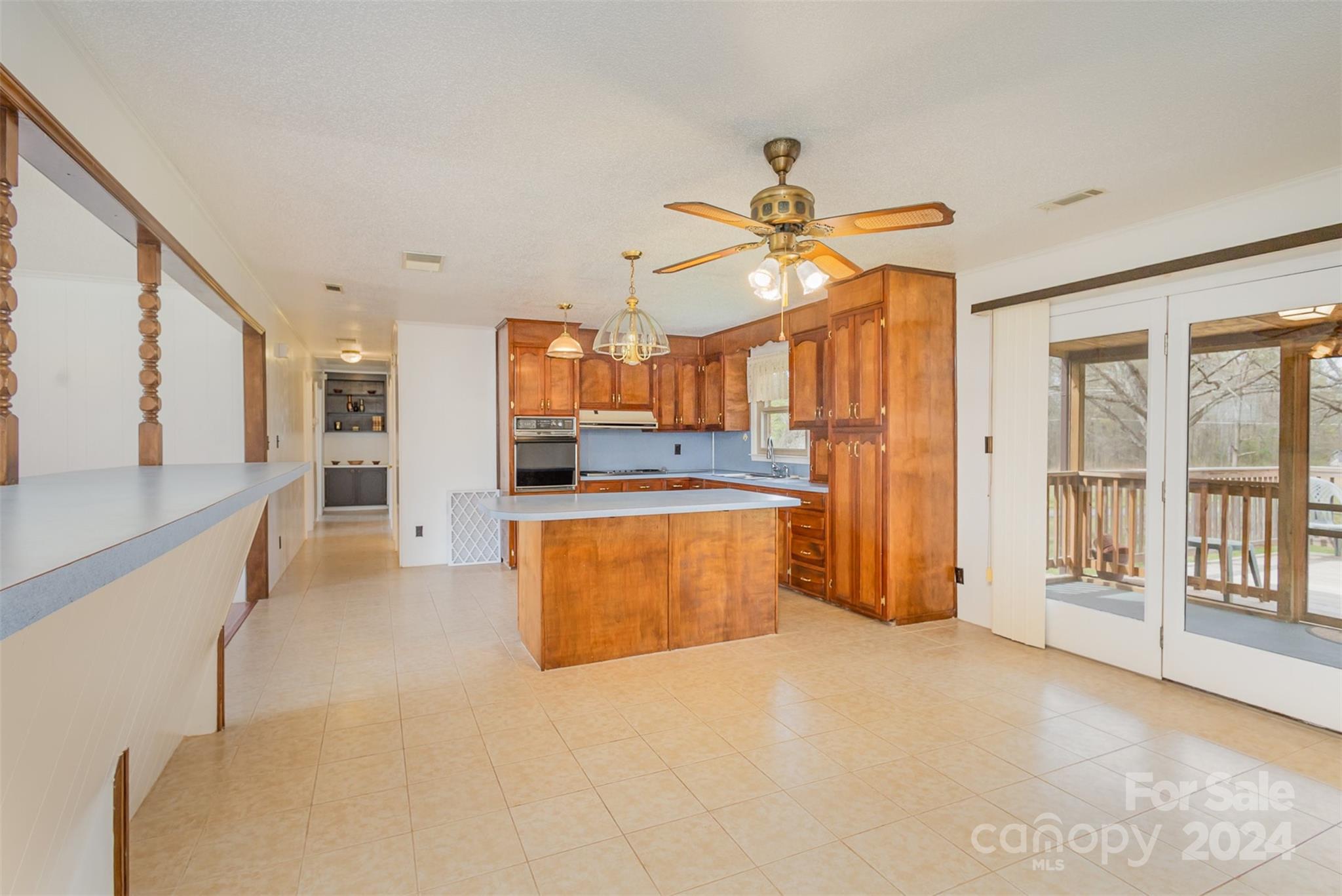 4007 Beaty Road Gastonia, NC 28056 - Photo 9 of 24 a view of a kitchen with a sink and a refrigerator