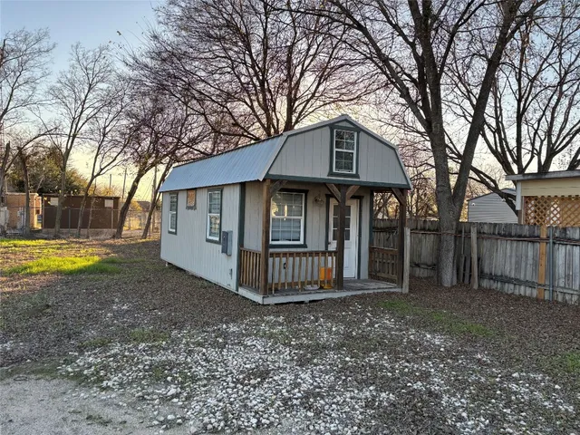 a view of a yard with swimming pool