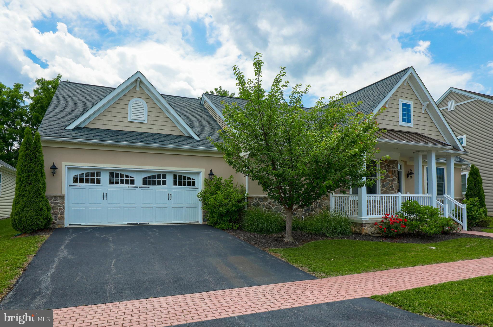 653 Dorset Street Lititz, PA 17543 - Photo 3 of 30 a front view of a house with a yard and garage