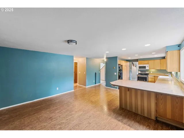 a view of kitchen with cabinets