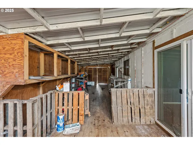 a view of a room with wooden walls