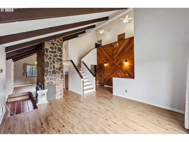 a view of an entryway with wooden floor