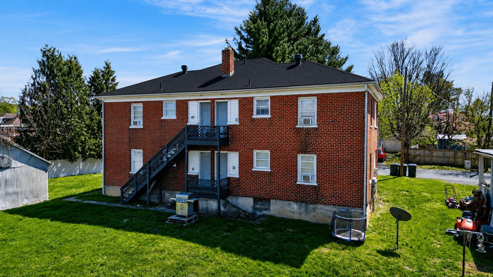 613 Alpha Street Waynesboro, VA 22980 - Photo 2 of 16 a front view of a house with a yard