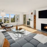 a living room with furniture fireplace and a flat screen tv