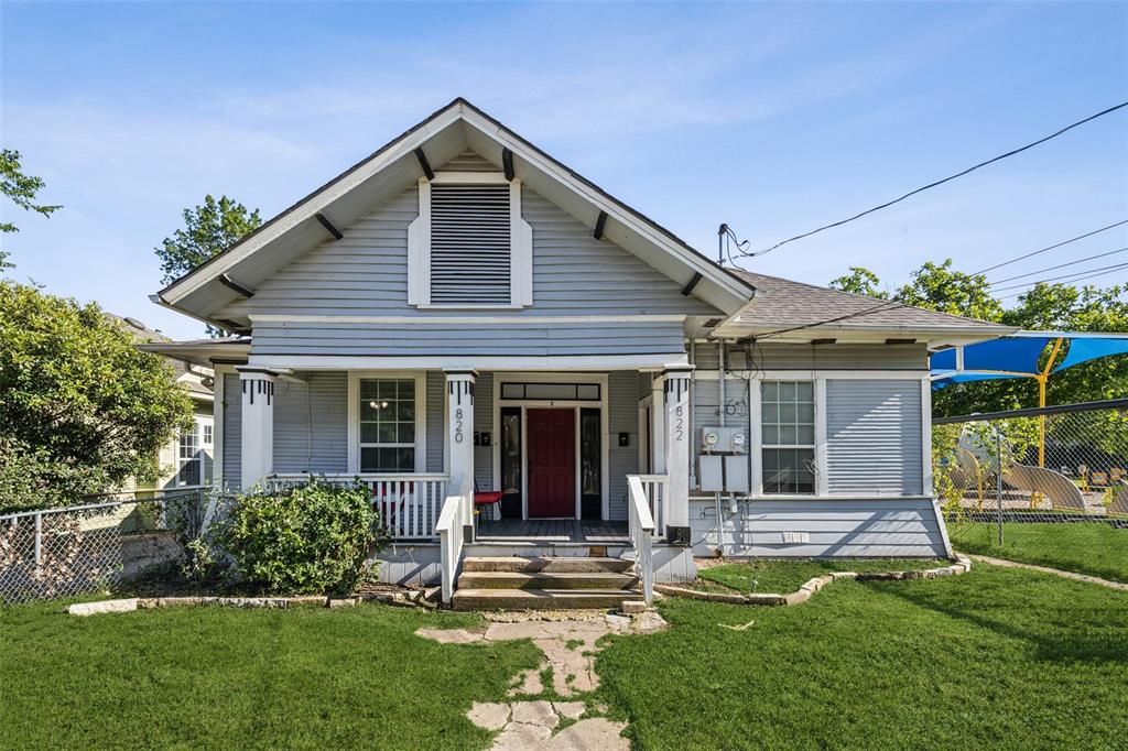 front view of a house with a yard