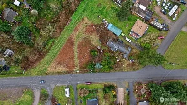 an aerial view of a residential houses with outdoor space