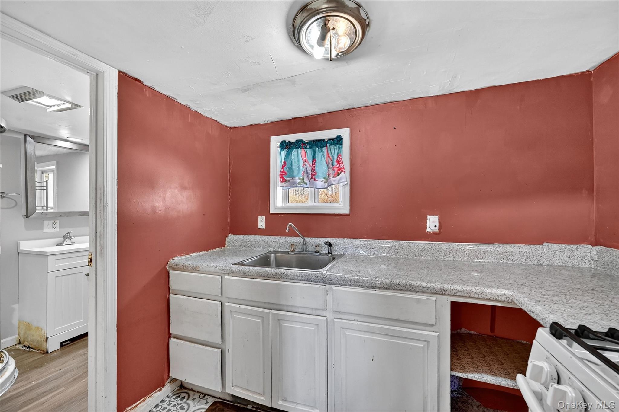 1187 Burlingham Road Pine Bush, NY 12566 - Photo 13 of 26 a bathroom with a granite countertop sink and a mirror