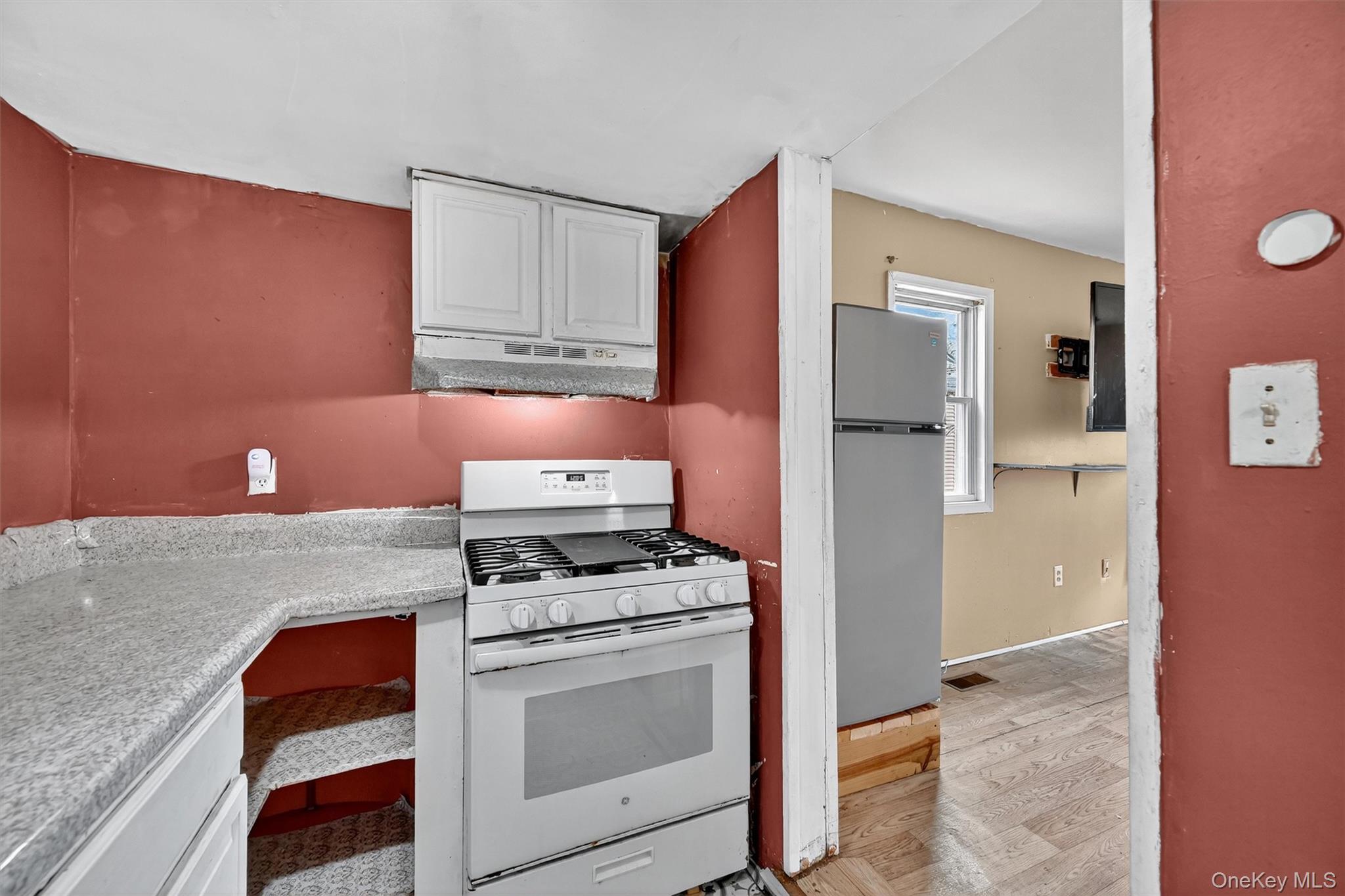 1187 Burlingham Road Pine Bush, NY 12566 - Photo 15 of 26 a kitchen with stainless steel appliances granite countertop a refrigerator and a stove
