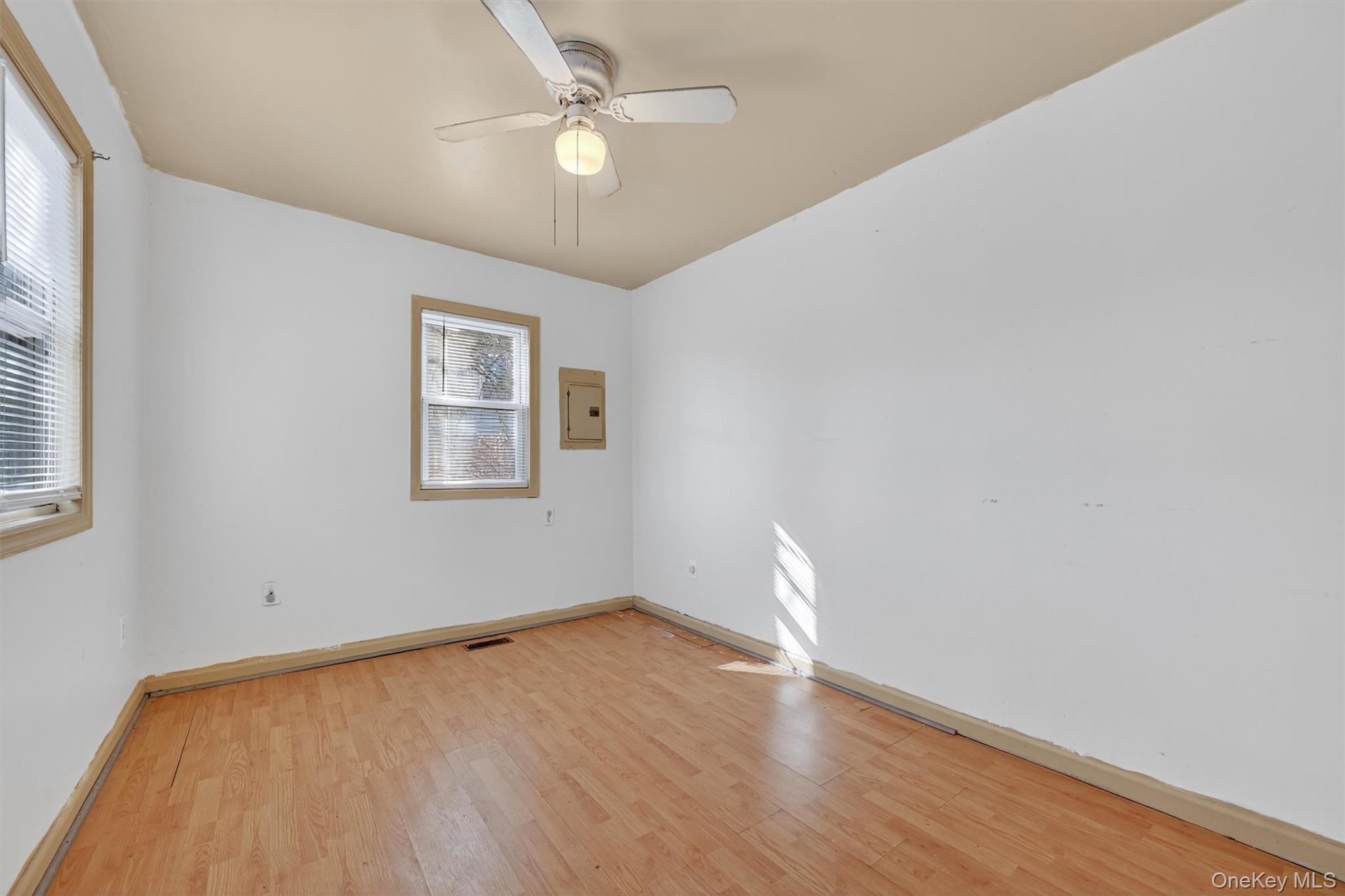1187 Burlingham Road Pine Bush, NY 12566 - Photo 17 of 26 wooden floor in an empty room with a window