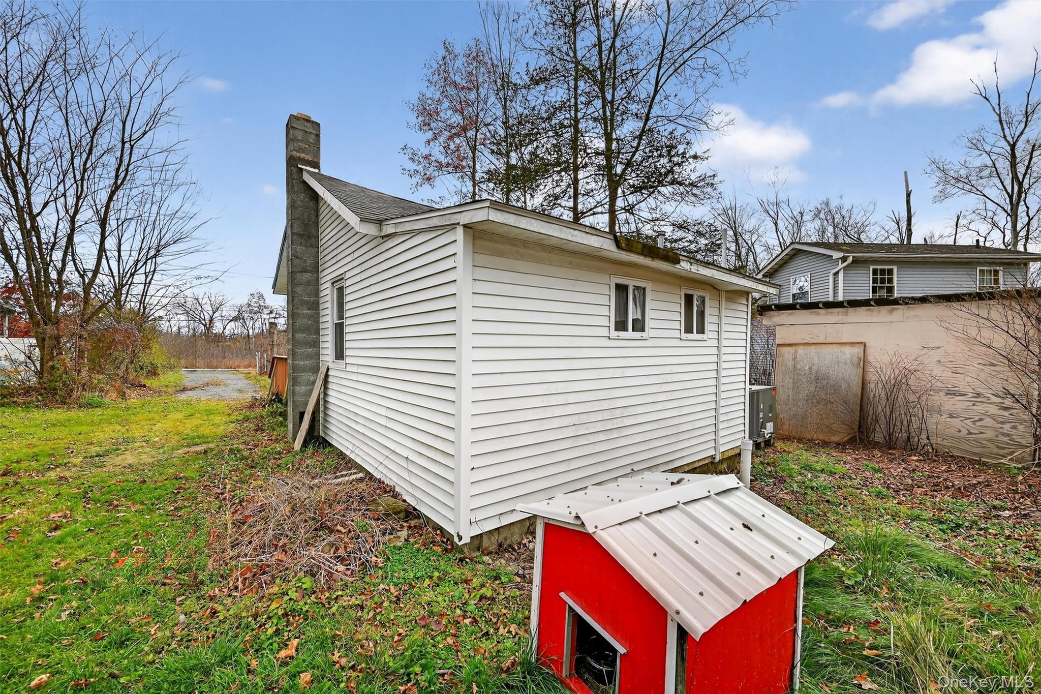 1187 Burlingham Road Pine Bush, NY 12566 - Photo 25 of 26 a view of a house with backyard and trees