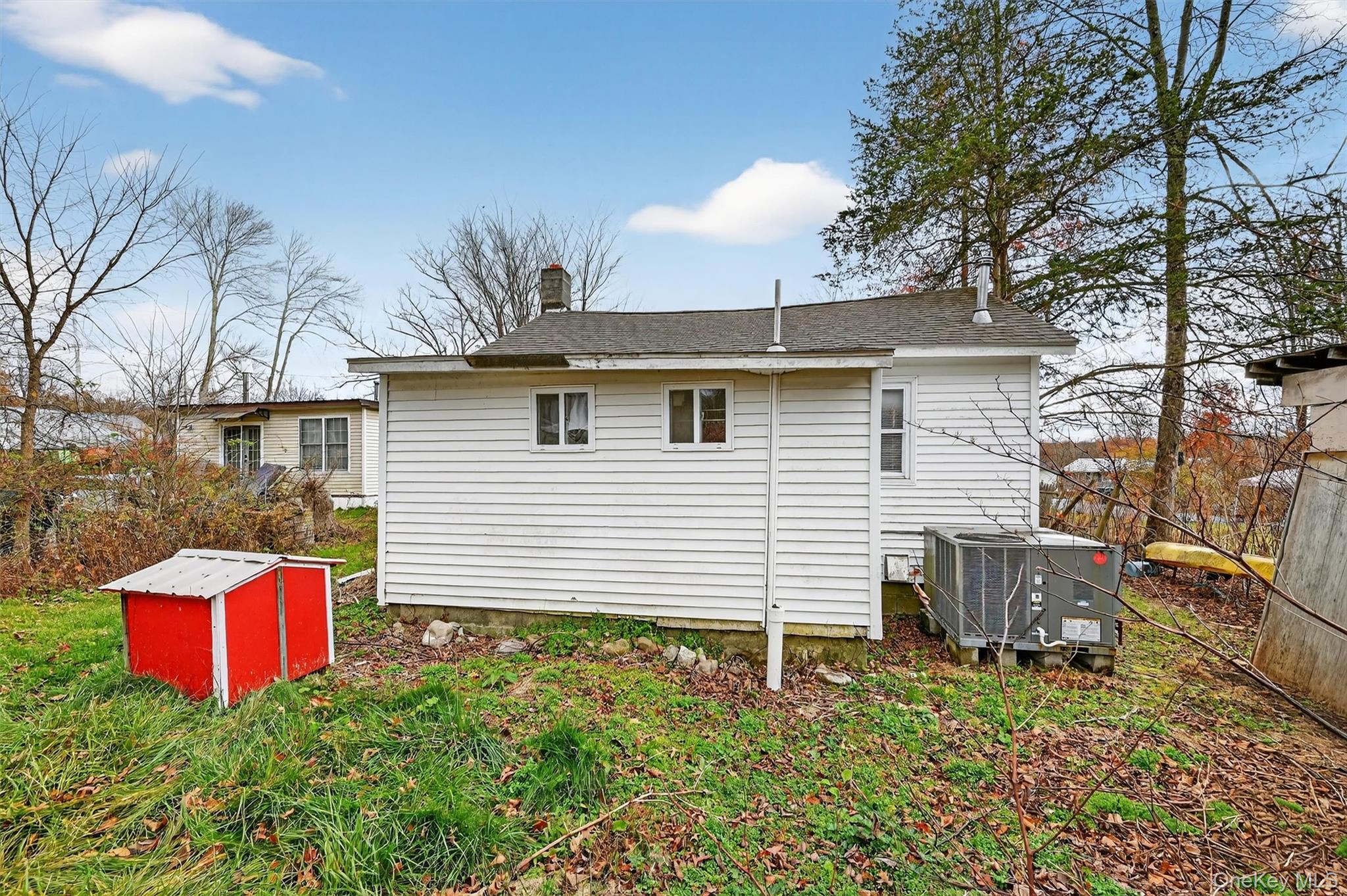 1187 Burlingham Road Pine Bush, NY 12566 - Photo 26 of 26 a front view of a house with yard and garage