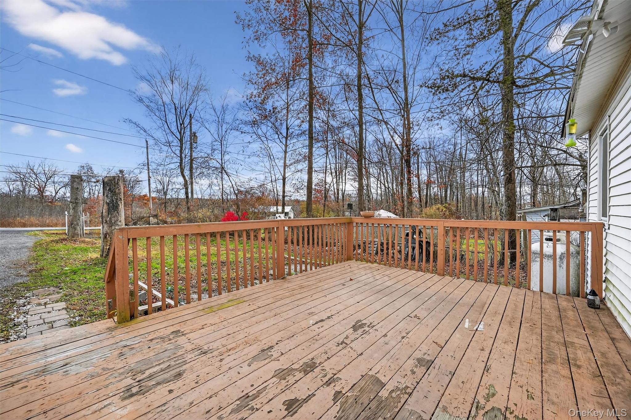 1187 Burlingham Road Pine Bush, NY 12566 - Photo 7 of 26 a balcony with trees in front of it