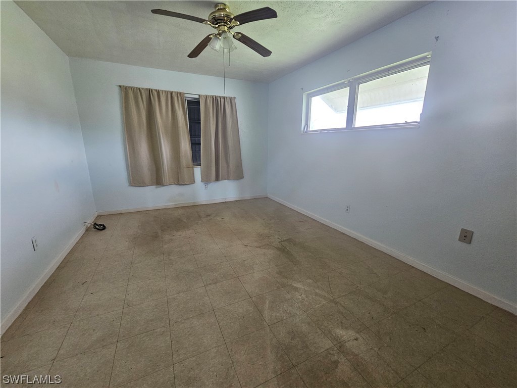 Undisclosed Address Lehigh Acres, FL 33936 - Photo 13 of 15 an empty room with windows