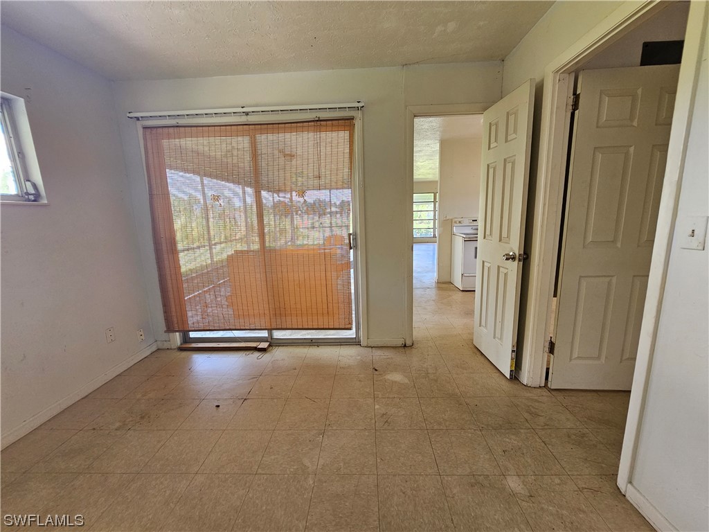 Undisclosed Address Lehigh Acres, FL 33936 - Photo 14 of 15 an empty room with a window
