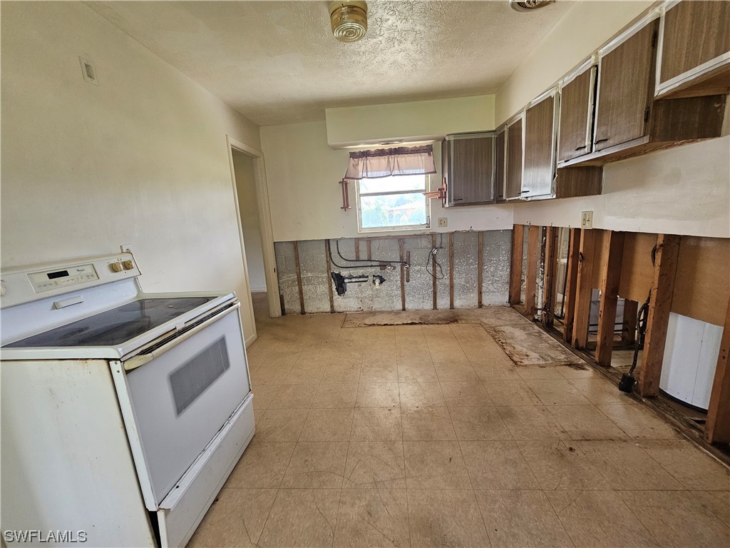 Undisclosed Address Lehigh Acres, FL 33936 - Photo 6 of 15 a utility room with dryer and washer