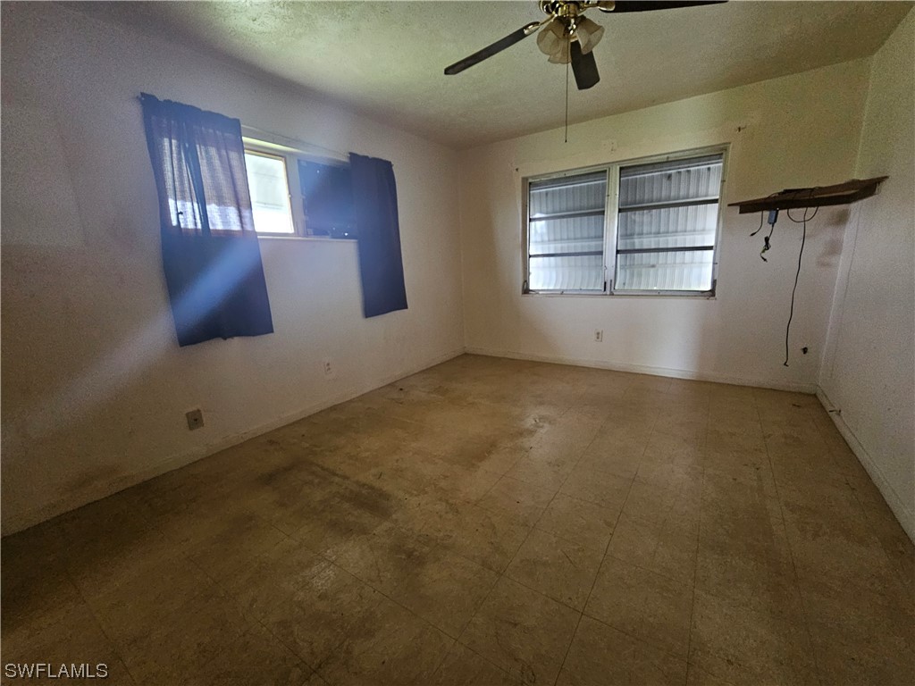 Undisclosed Address Lehigh Acres, FL 33936 - Photo 10 of 15 an empty room with windows