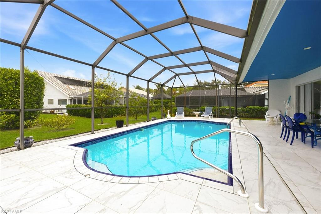 209 Countryside Drive Naples, FL 34104 - Photo 29 of 50 a view of a swimming pool with a patio
