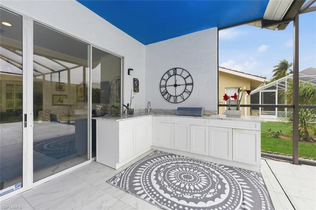 209 Countryside Drive Naples, FL 34104 - Photo 32 of 50 a view of a hallway with entryway