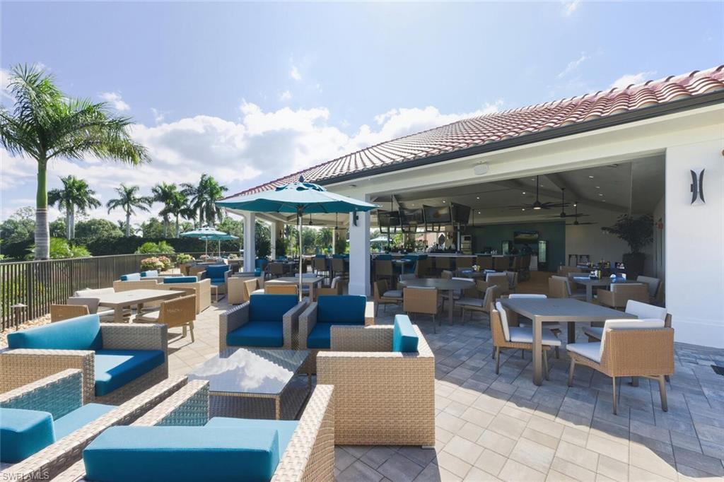 209 Countryside Drive Naples, FL 34104 - Photo 39 of 50 a view of a patio with dining table and chairs with plants