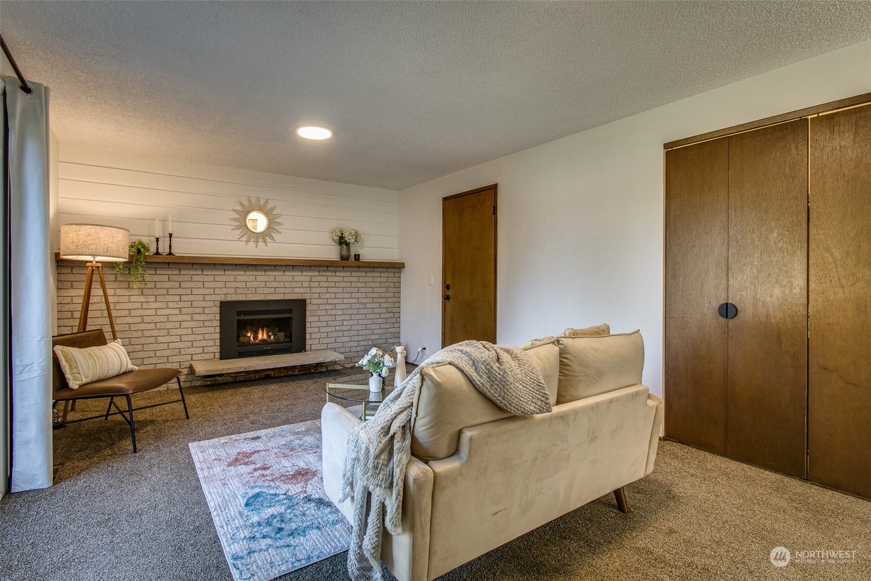 514 Cypress Road Bellingham, WA 98225 - Photo 12 of 31 a living room with furniture and a fireplace