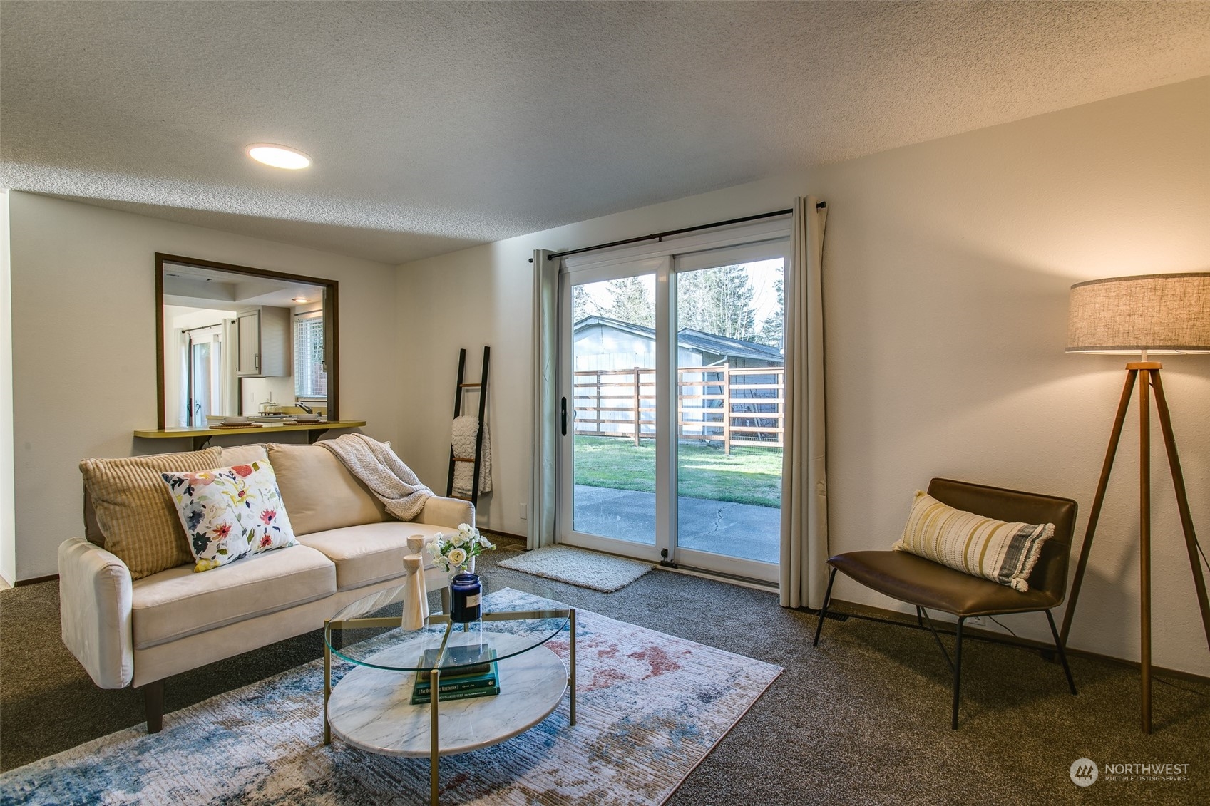 514 Cypress Road Bellingham, WA 98225 - Photo 14 of 31 a living room with furniture and a floor to ceiling window