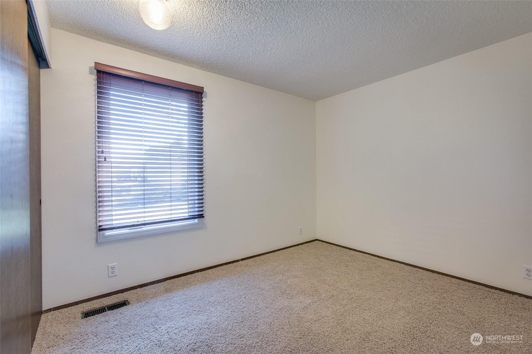 514 Cypress Road Bellingham, WA 98225 - Photo 17 of 31 an empty room with a window