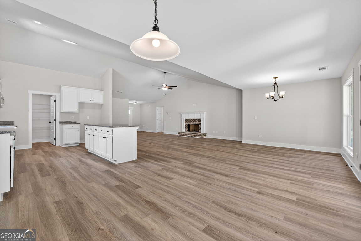 206 Airport Road, Unit 11 Canon, GA 30520 - Photo 19 of 34 an empty room with wooden floor and windows