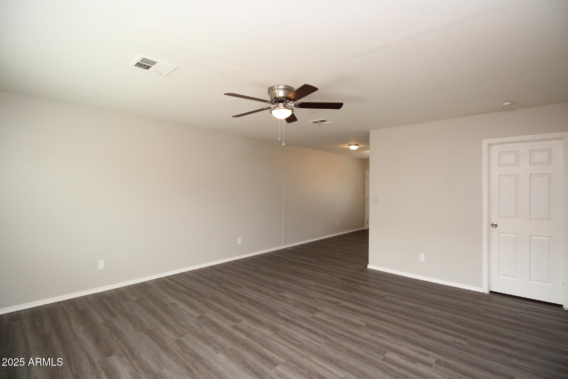 1732 West Maricopa Street, Unit 1 Phoenix, AZ 85007 - Photo 18 of 30 a view of an empty room with wooden floor