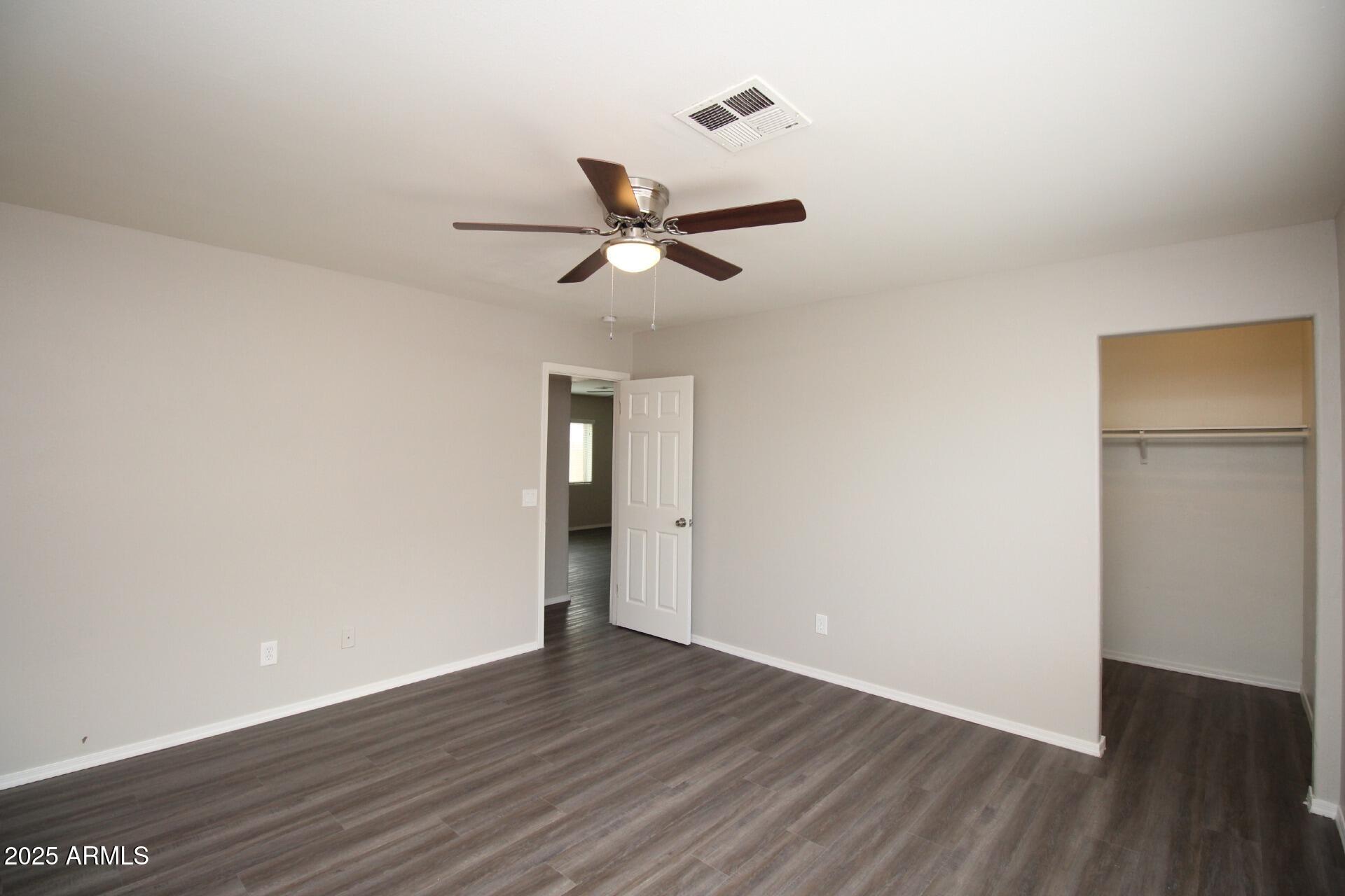 1732 West Maricopa Street, Unit 1 Phoenix, AZ 85007 - Photo 20 of 30 a view of a room with wooden floor and a ceiling fan
