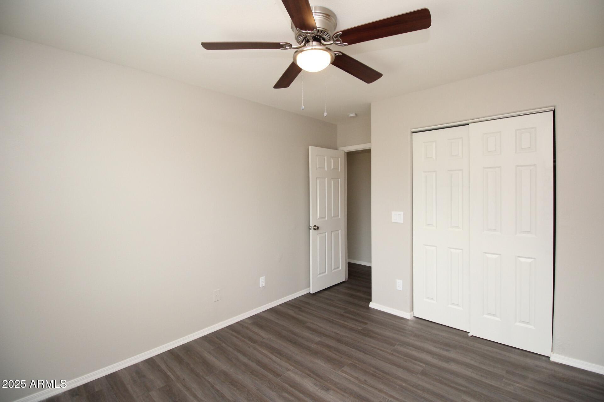 1732 West Maricopa Street, Unit 1 Phoenix, AZ 85007 - Photo 22 of 30 a view of an empty room with wooden floor